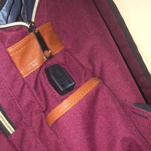 This burgundy backpack is slightly used but still looks and works brand new!